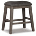 Ashley Express - Caitbrook Upholstered Stool (2/CN) - DecorGalore4U