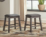 Ashley Express - Caitbrook Upholstered Stool (2/CN) - DecorGalore4U