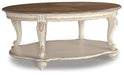 Ashley Express - Realyn Oval Cocktail Table - DecorGalore4U
