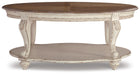 Ashley Express - Realyn Oval Cocktail Table - DecorGalore4U