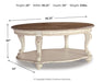 Ashley Express - Realyn Oval Cocktail Table - DecorGalore4U