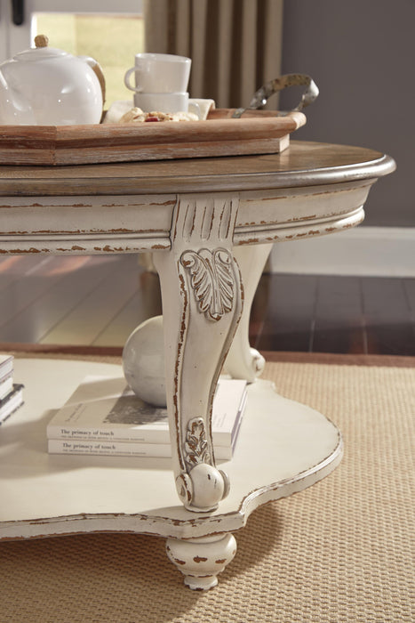 Ashley Express - Realyn Oval Cocktail Table - DecorGalore4U