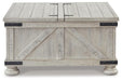 Ashley Express - Carynhurst Cocktail Table with Storage - DecorGalore4U