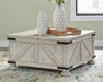 Ashley Express - Carynhurst Cocktail Table with Storage - DecorGalore4U