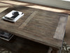 Ashley Express - Johnelle Rectangular Cocktail Table - DecorGalore4U