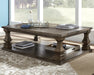 Ashley Express - Johnelle Rectangular Cocktail Table - DecorGalore4U
