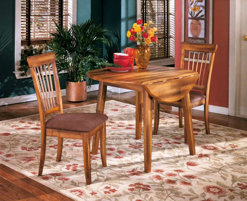 Ashley Express - Berringer Round DRM Drop Leaf Table DecorGalore4U - Shop Home Decor Online with Free Shipping