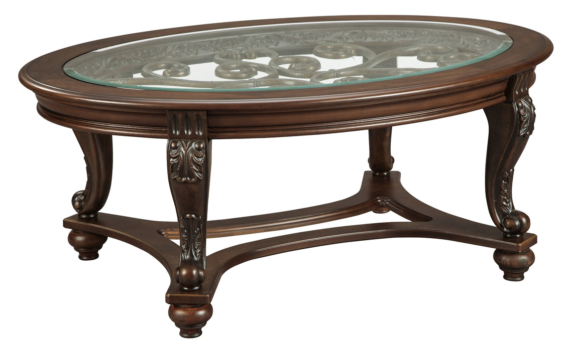 Ashley Express - Norcastle Oval Cocktail Table DecorGalore4U - Shop Home Decor Online with Free Shipping